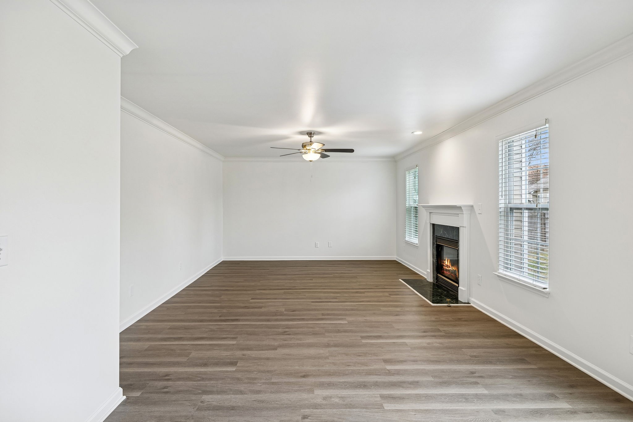 1849 Devon Drive Spring Hill, TN 37174 - Photo 13 of 58 an empty room with windows and fireplace