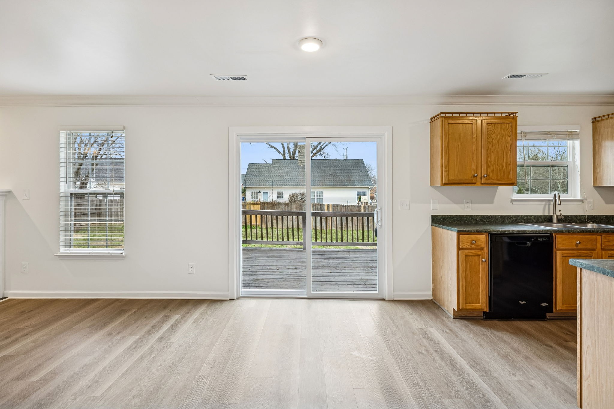 1849 Devon Drive Spring Hill, TN 37174 - Photo 17 of 58 an empty room with a fireplace and windows