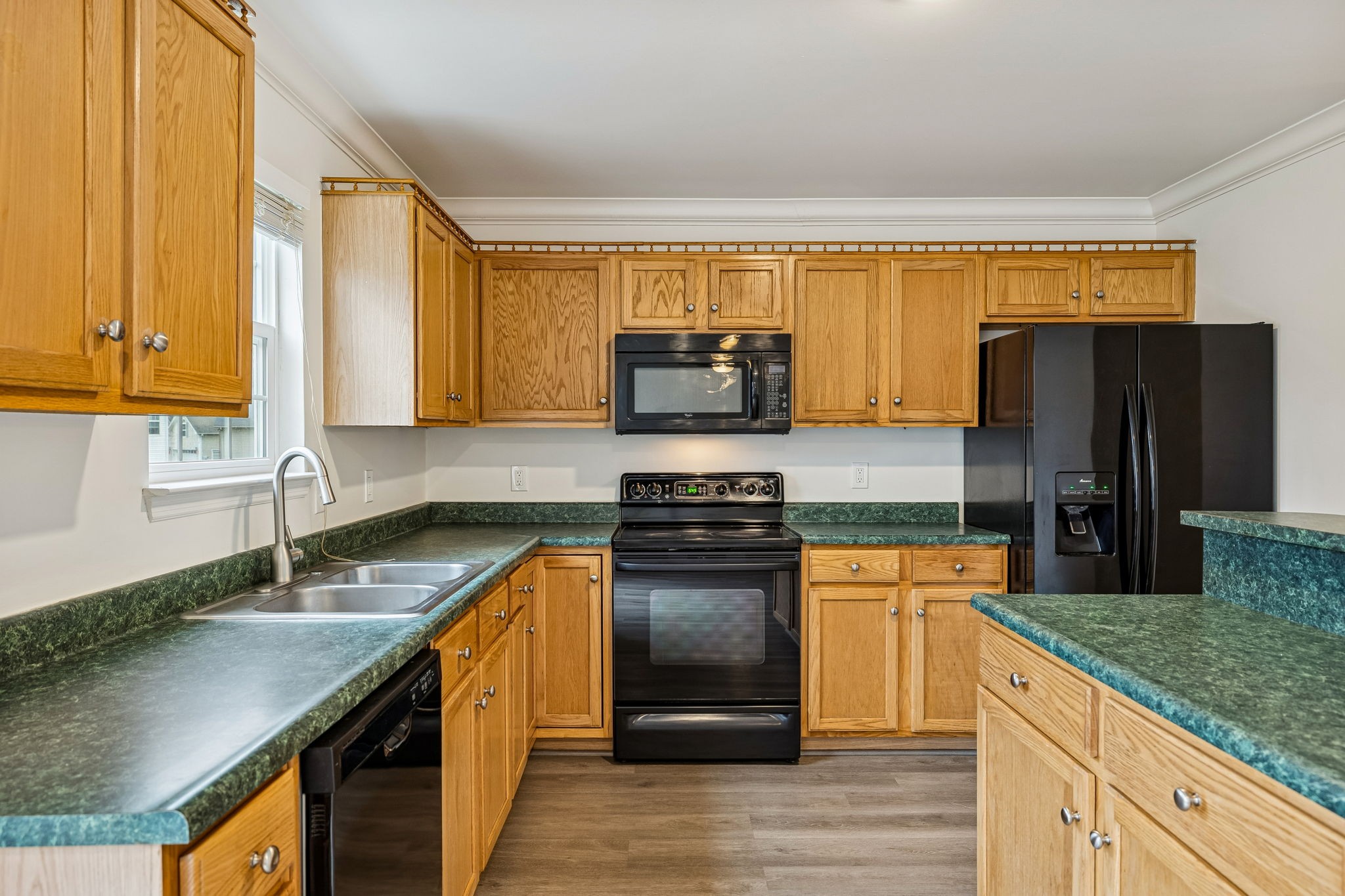 1849 Devon Drive Spring Hill, TN 37174 - Photo 21 of 58 a kitchen with granite countertop a sink cabinets and stainless steel appliances