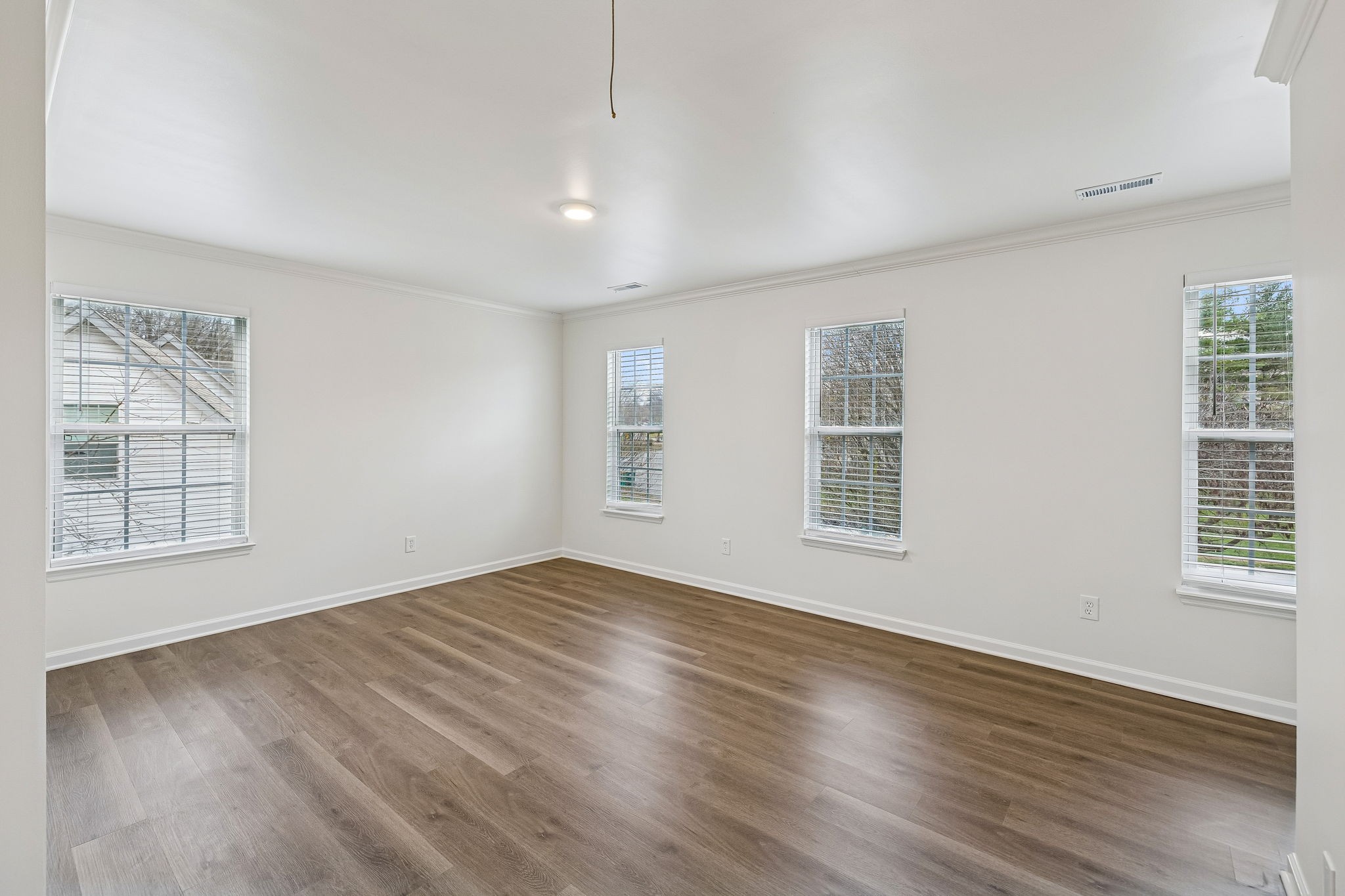 1849 Devon Drive Spring Hill, TN 37174 - Photo 29 of 58 an empty room with wooden floor and windows