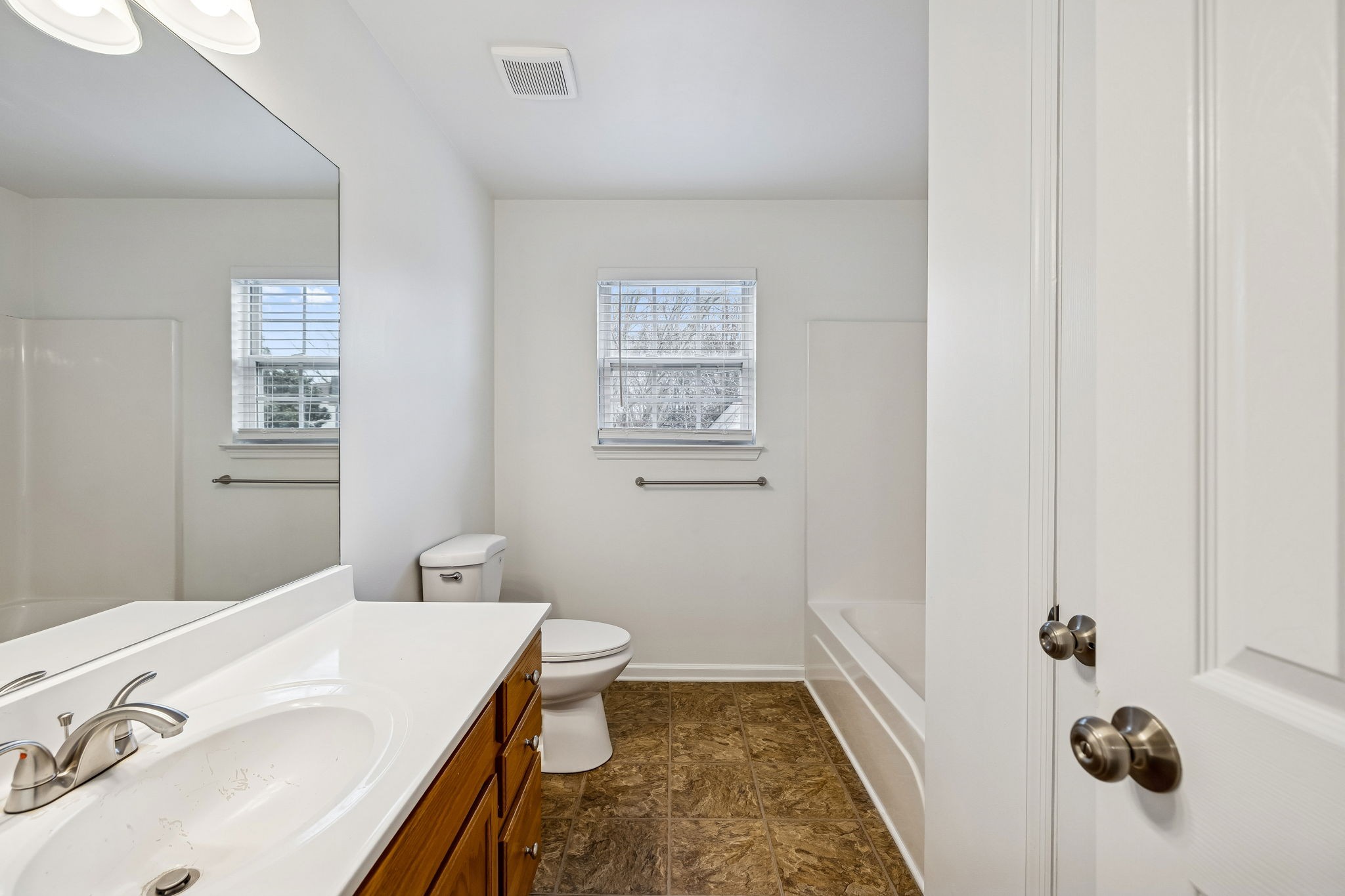 1849 Devon Drive Spring Hill, TN 37174 - Photo 35 of 58 a bathroom with a sink and a mirror