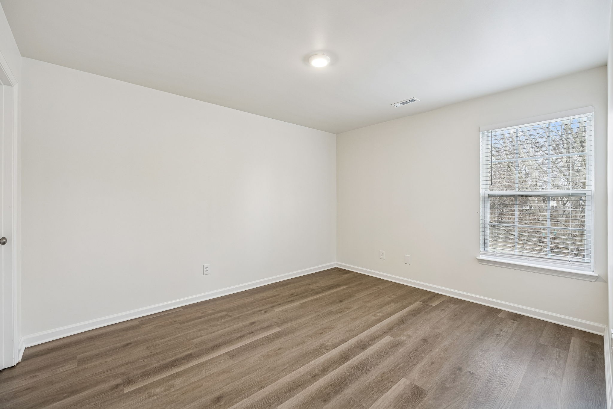 1849 Devon Drive Spring Hill, TN 37174 - Photo 36 of 58 wooden floor in an empty room with a window