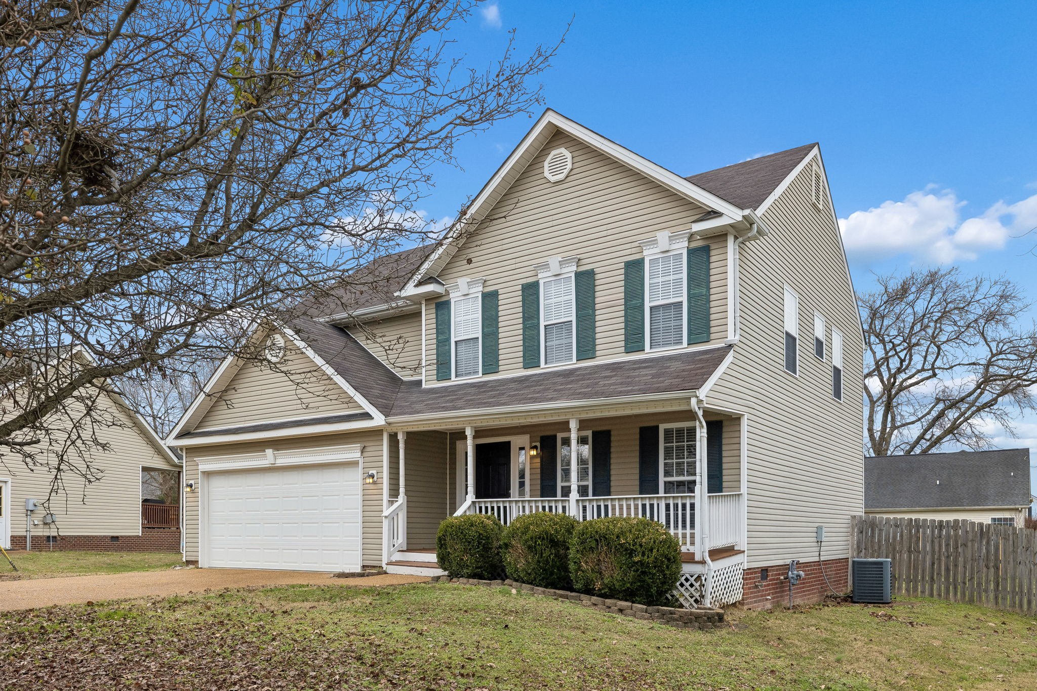 1849 Devon Drive Spring Hill, TN 37174 - Photo 4 of 58 a front view of a house with a yard and garage