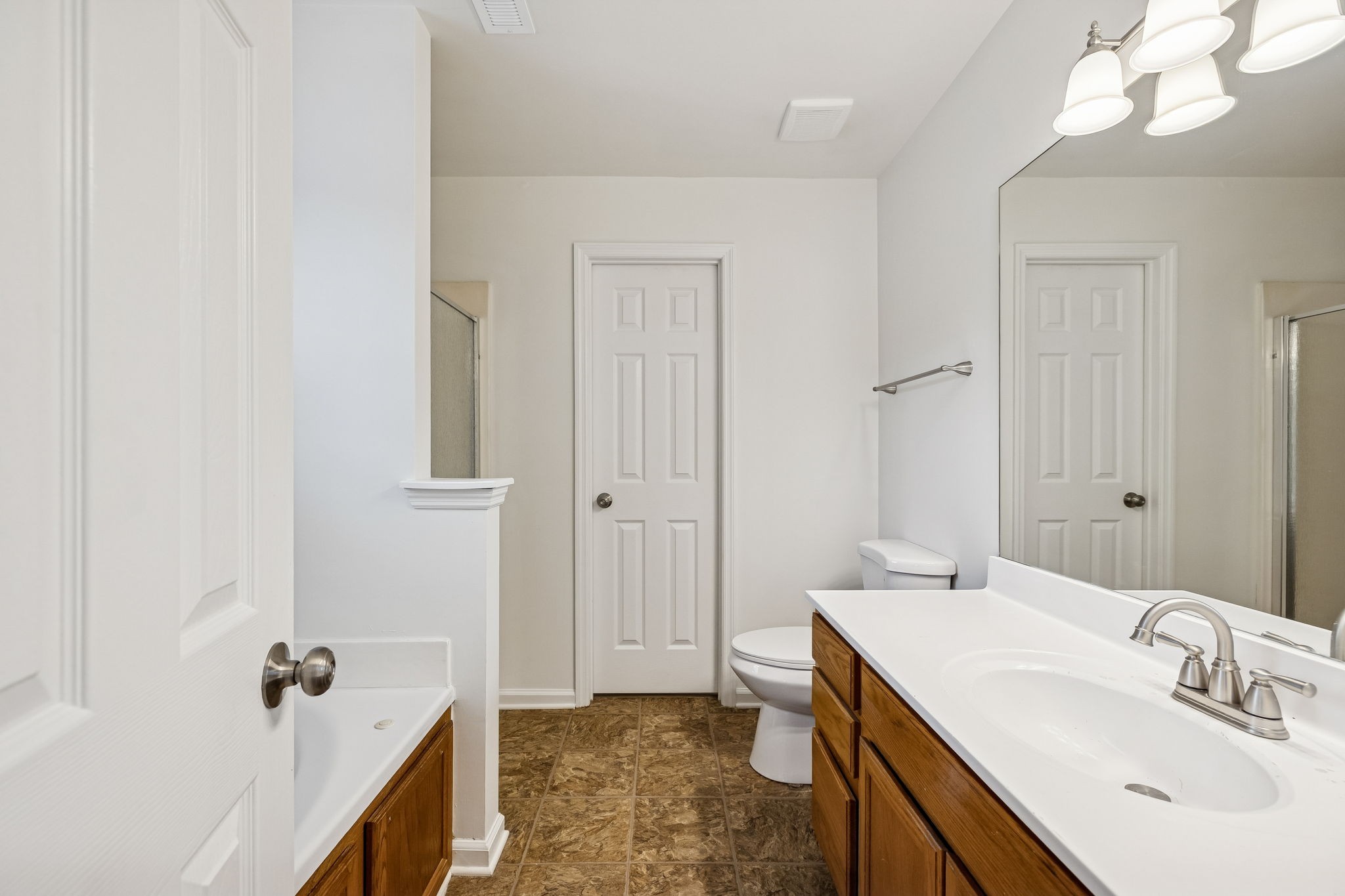 1849 Devon Drive Spring Hill, TN 37174 - Photo 45 of 58 a bathroom with a sink a toilet and shower
