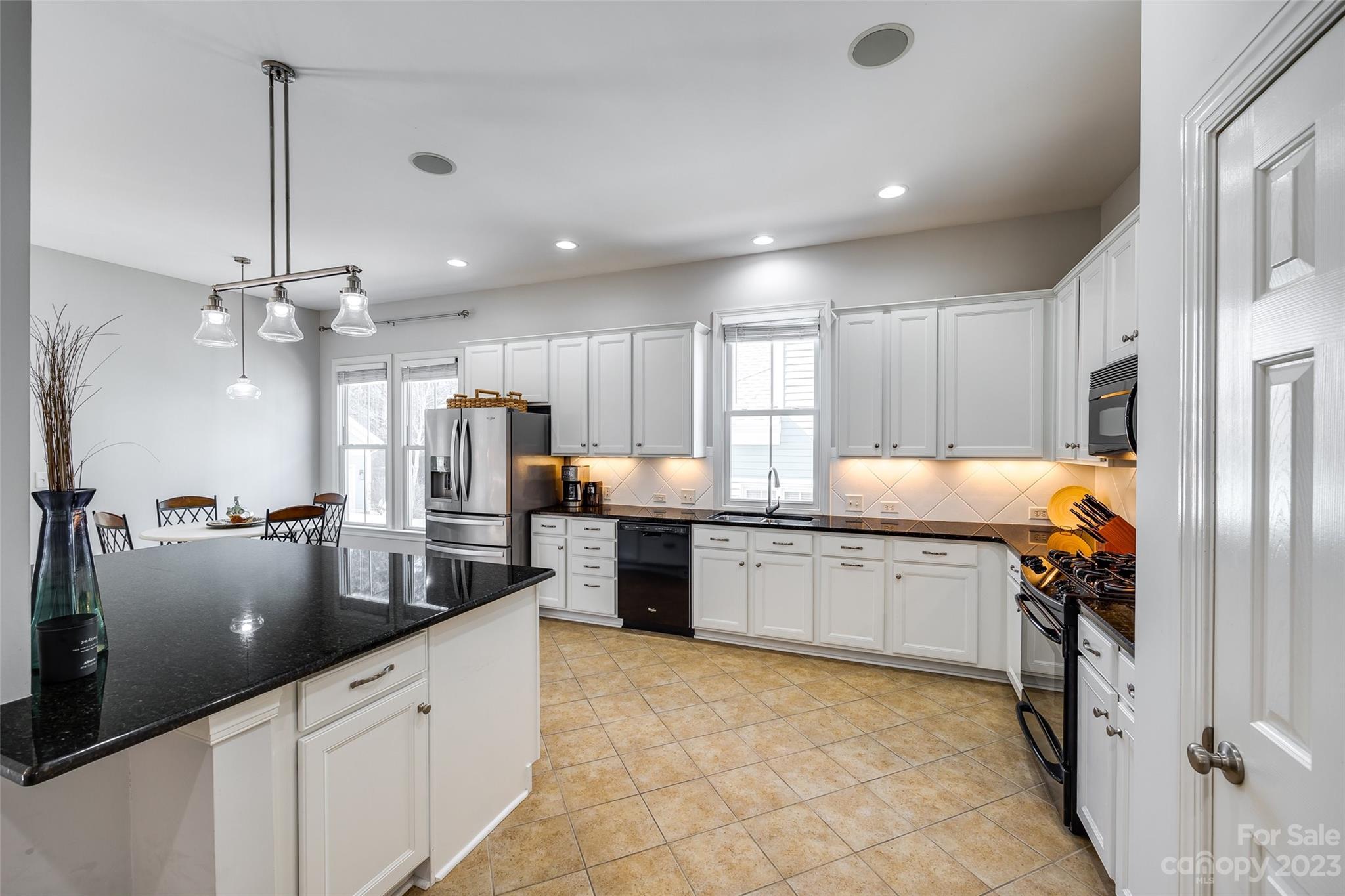 109 Mills Lane Fort Mill, SC 29708 - Photo 17 of 48 a kitchen with counter top space a sink appliances and cabinets