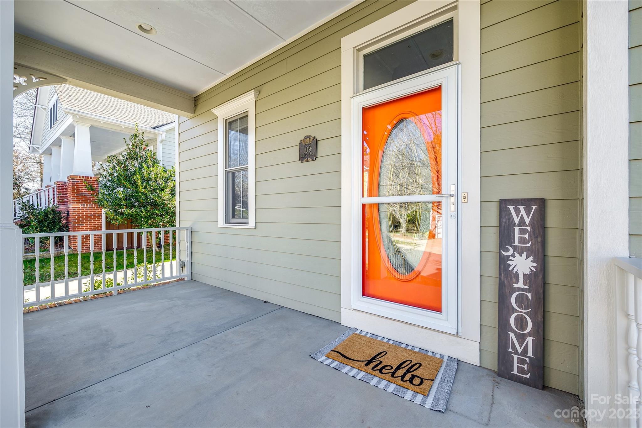 109 Mills Lane Fort Mill, SC 29708 - Photo 3 of 48 a view of a porch with wooden floor and a gate