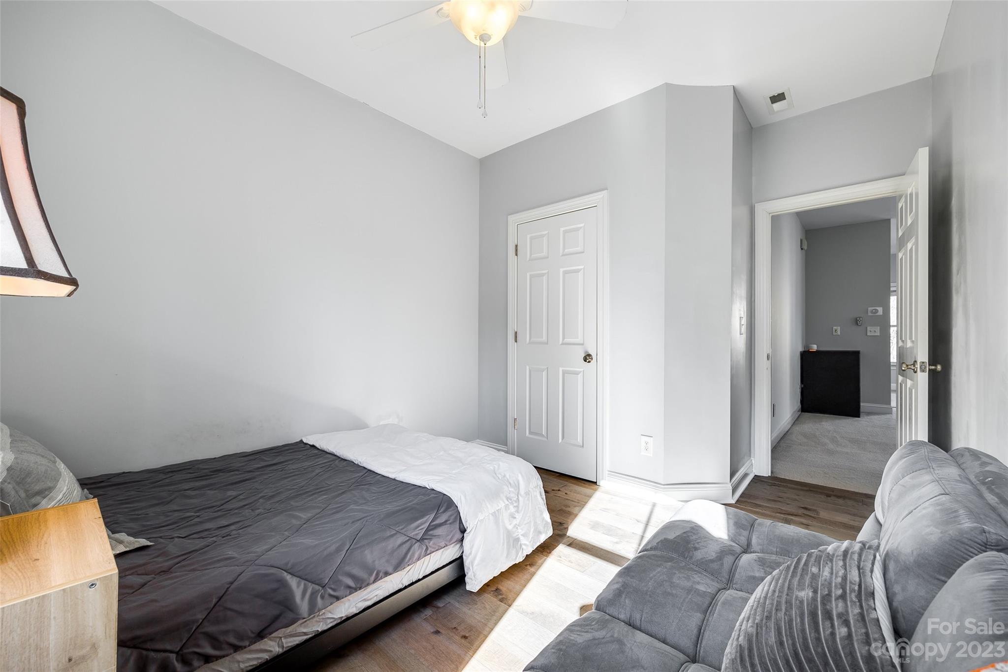 109 Mills Lane Fort Mill, SC 29708 - Photo 31 of 48 a bedroom with a bed and a couch