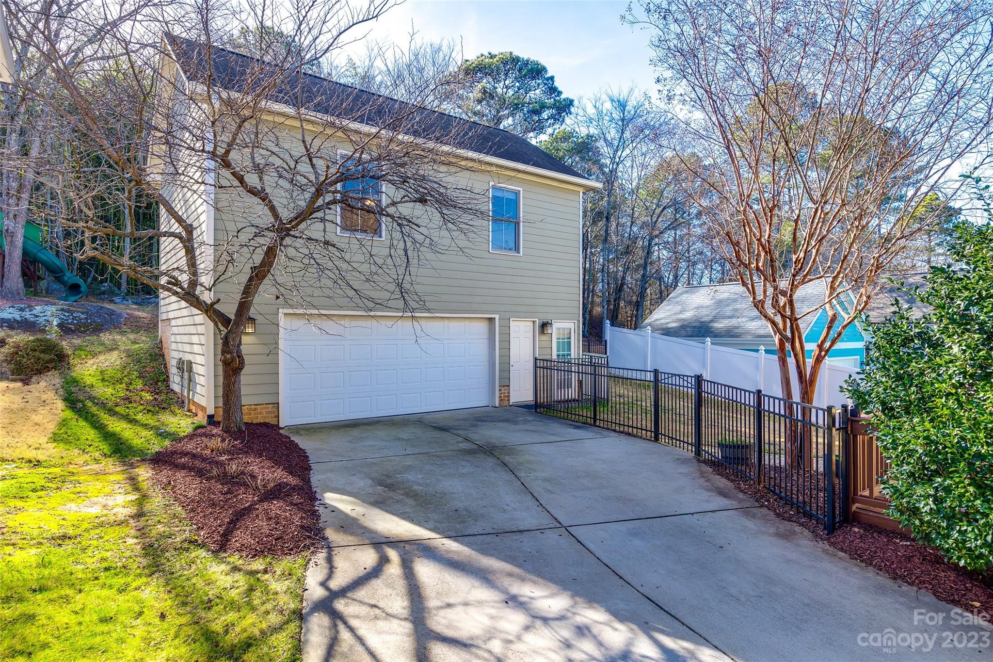 109 Mills Lane Fort Mill, SC 29708 - Photo 38 of 48 a view of a house with a large tree and a yard