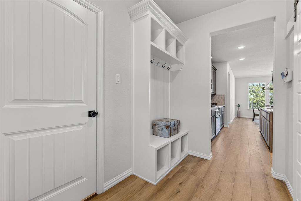 400 Hayden Faith Court Springtown, TX 76082 - Photo 15 of 35 a view of a hallway with wooden floor and furniture