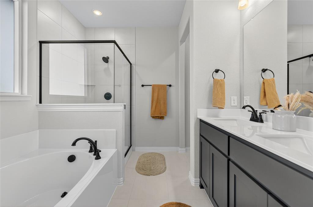 400 Hayden Faith Court Springtown, TX 76082 - Photo 23 of 35 a bathroom with a tub sink and mirror