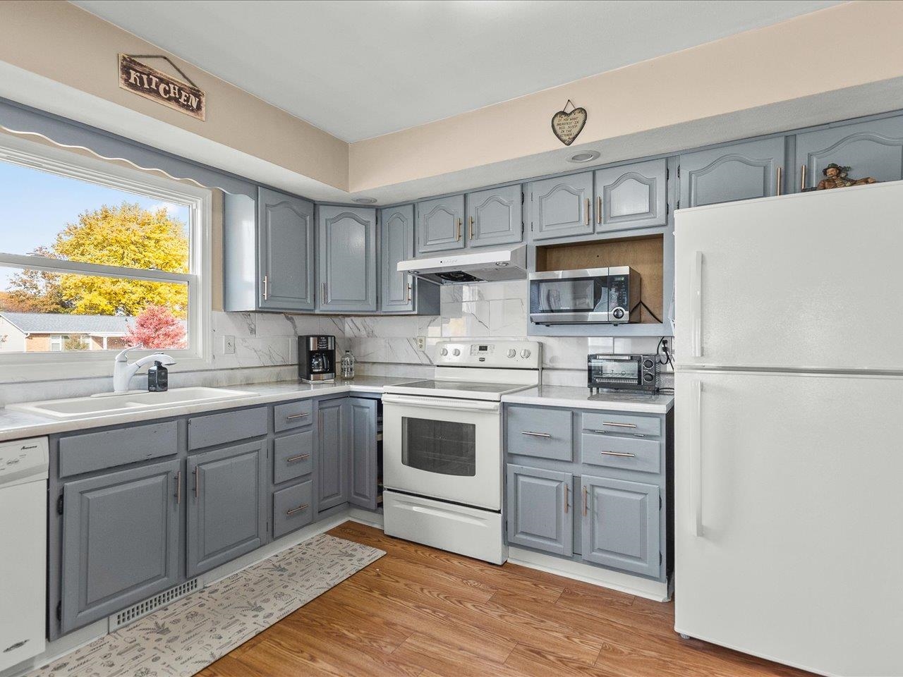 1919 Tomahawk Court Freeport, IL 61032 - Photo 11 of 39 a kitchen with a refrigerator stove and sink