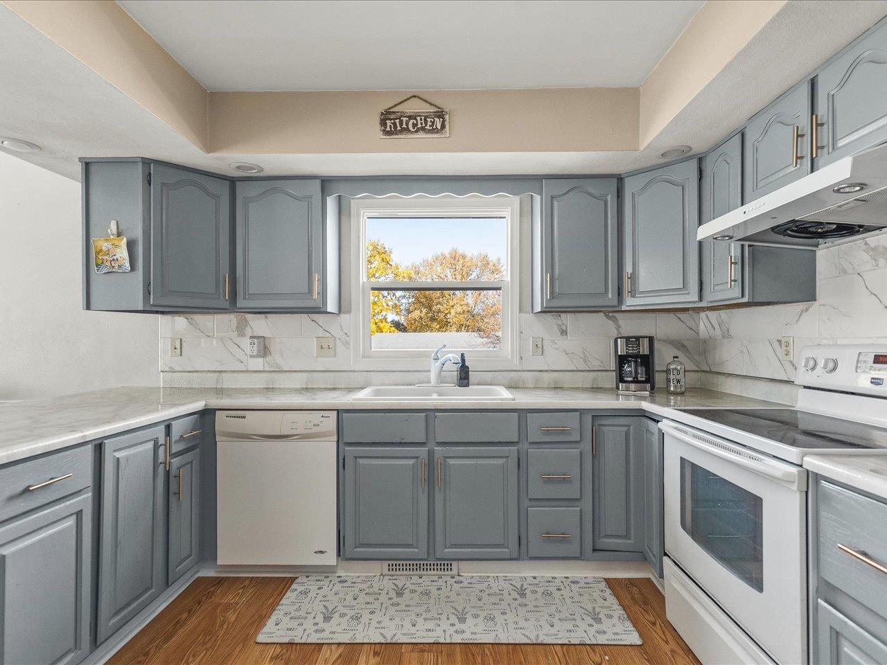 1919 Tomahawk Court Freeport, IL 61032 - Photo 13 of 39 a kitchen with a sink stove and cabinets