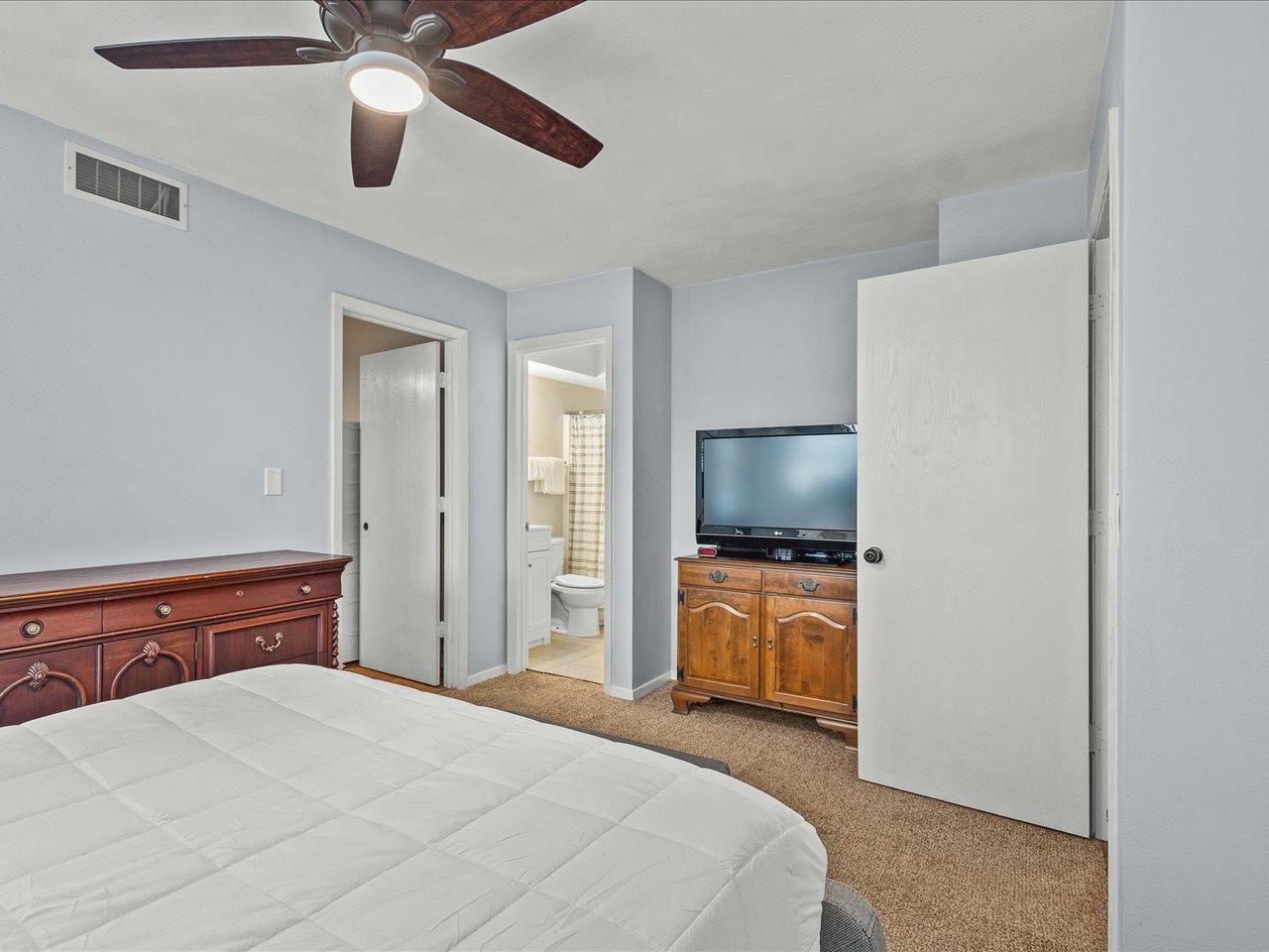 1919 Tomahawk Court Freeport, IL 61032 - Photo 25 of 39 a bedroom with a bed and a flat screen tv