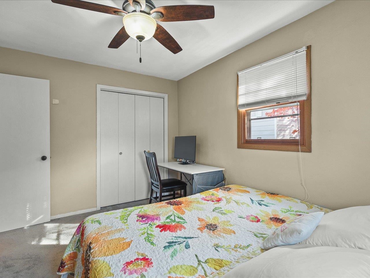 1919 Tomahawk Court Freeport, IL 61032 - Photo 28 of 39 a bedroom with a bed and a chandelier