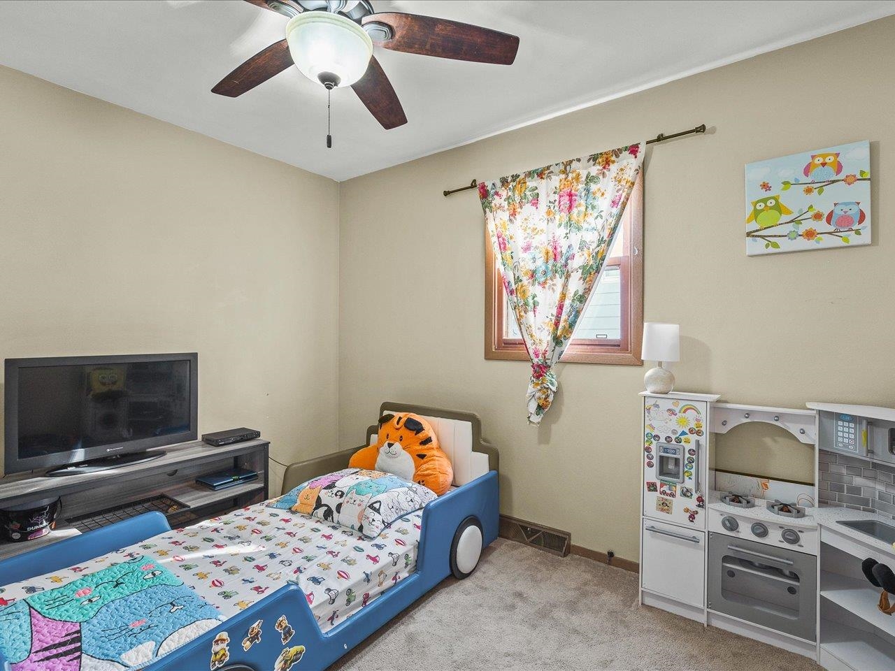 1919 Tomahawk Court Freeport, IL 61032 - Photo 29 of 39 a bedroom with a bed and a tv