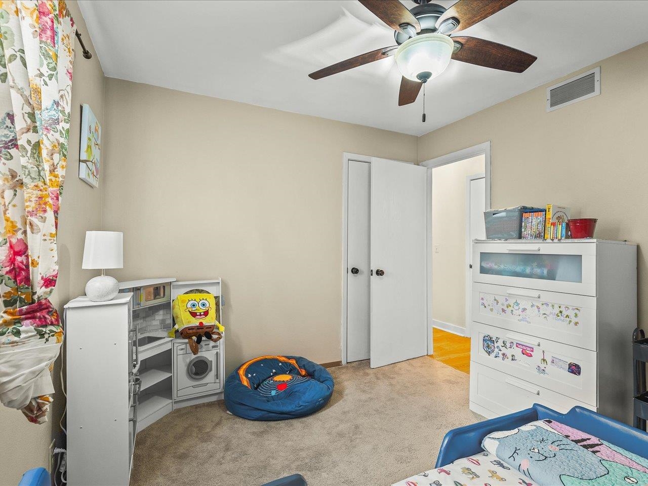 1919 Tomahawk Court Freeport, IL 61032 - Photo 30 of 39 a bedroom with a bed and a chandelier