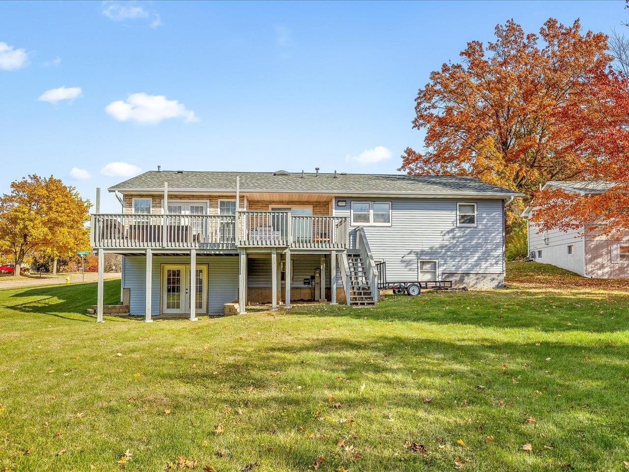 1919 Tomahawk Court Freeport, IL 61032 - Photo 37 of 39 a view of a house with a big yard and large trees