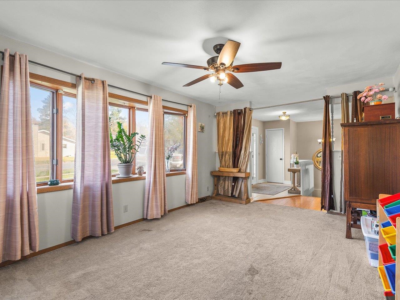 1919 Tomahawk Court Freeport, IL 61032 - Photo 7 of 39 a view of a livingroom with furniture and a ceiling fan