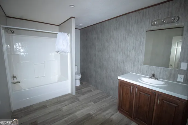 a bathroom with a sink and shower