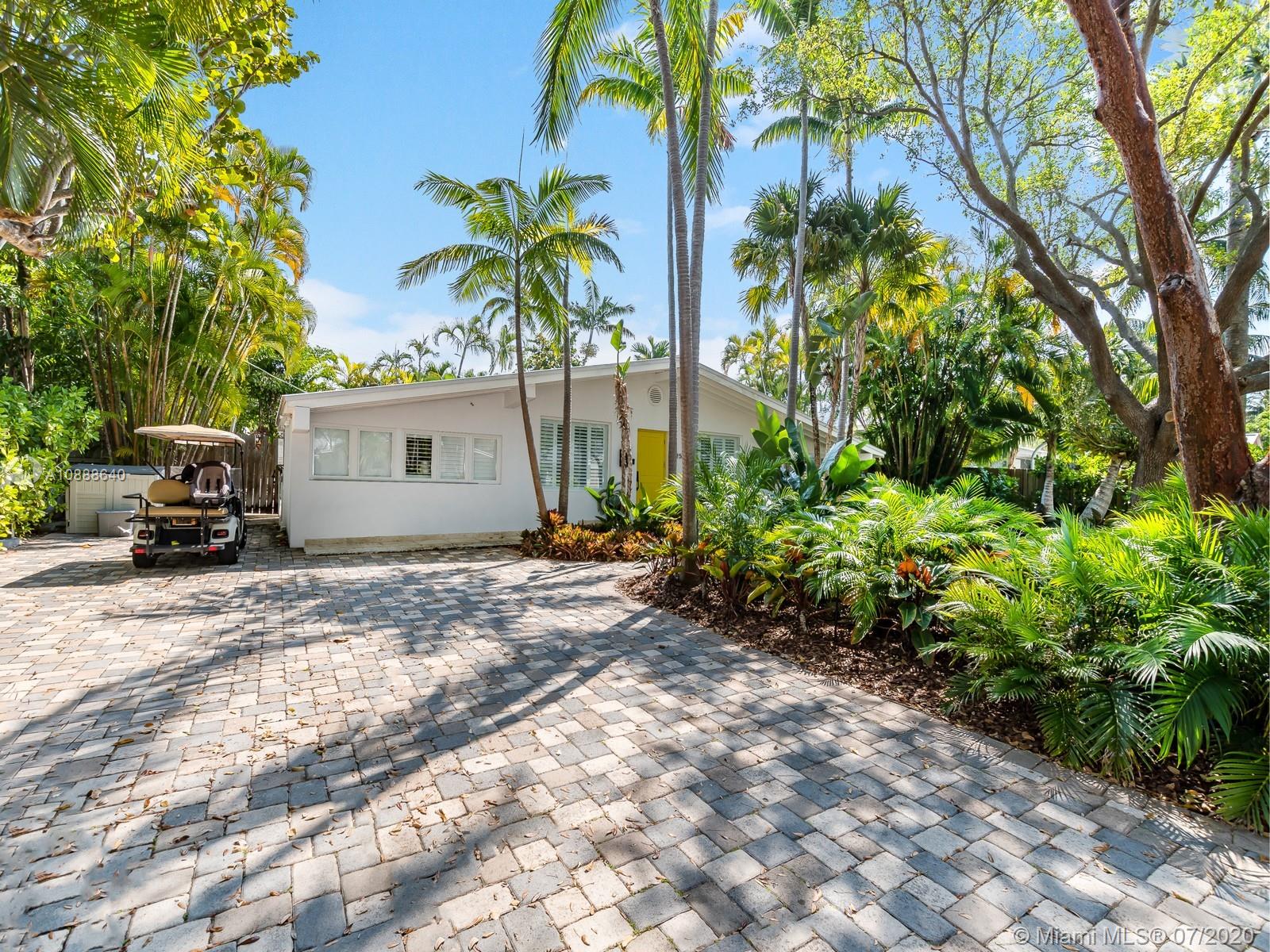 255 Glenridge Road Key Biscayne, FL 33149 - Photo 2 of 25 a view of a house with a cars park