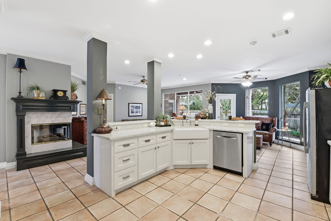 16322 Cranwood Drive Spring, TX 77379 - Photo 21 of 42 Discover a spacious kitchen where the multifunctional center island offers both versatility and a stunning view, perfect for cooking and entertaining.