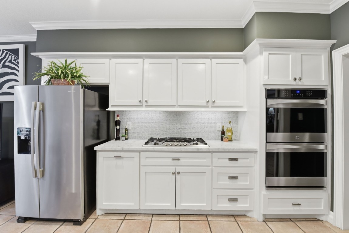 16322 Cranwood Drive Spring, TX 77379 - Photo 22 of 42 This kitchen features a sleek gas range with ample prep space and abundant cabinet storage, perfect for culinary enthusiasts.