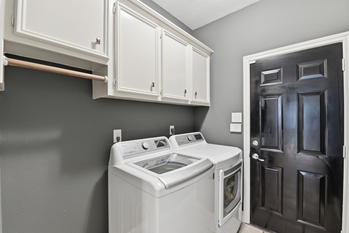 16322 Cranwood Drive Spring, TX 77379 - Photo 25 of 42 The laundry room has additional storage and a hanging rack