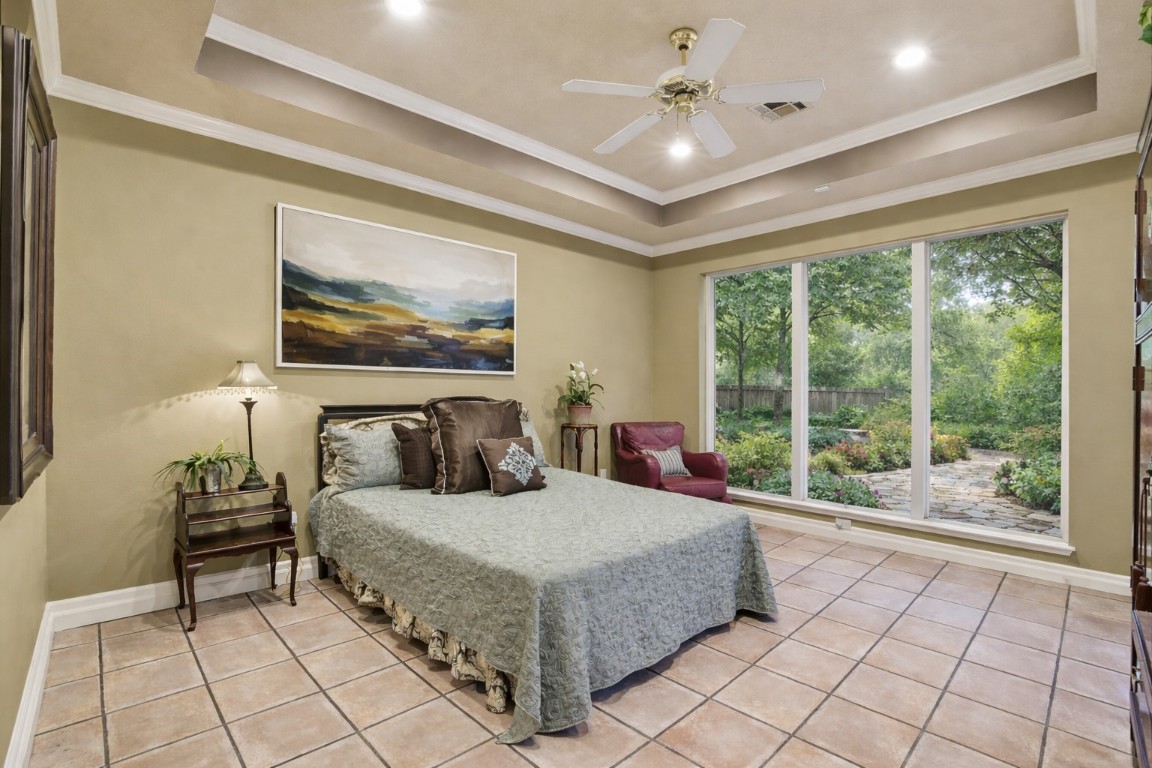16322 Cranwood Drive Spring, TX 77379 - Photo 28 of 42 As you enter the Primary Bedroom, you are greeted with a gorgeous wall of windows.