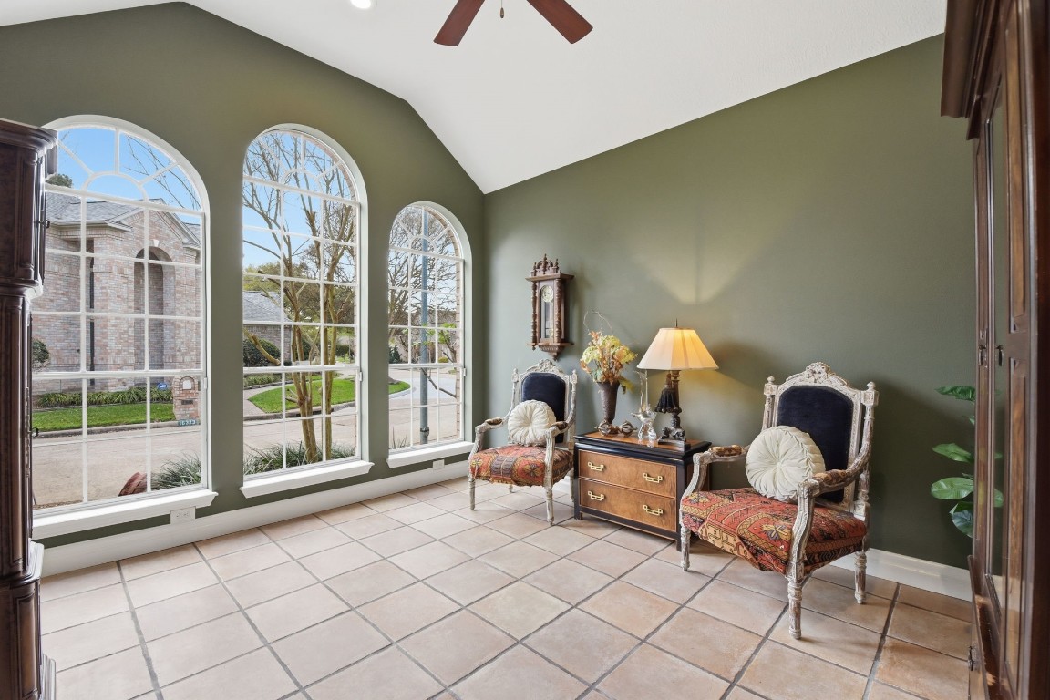 16322 Cranwood Drive Spring, TX 77379 - Photo 6 of 42 The second den or home office is a luminous retreat, featuring stunning arched windows that flood the space with natural light.