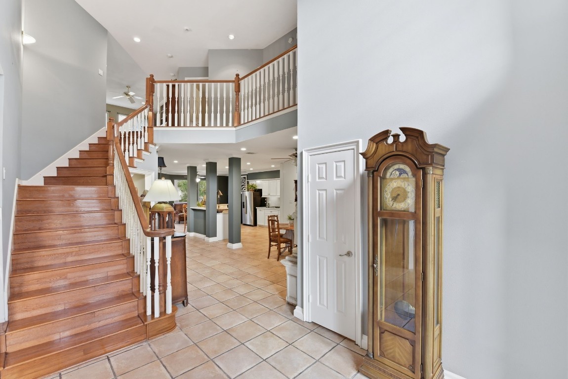 16322 Cranwood Drive Spring, TX 77379 - Photo 8 of 42 Ascend the elegant hardwood staircase to discover a spacious game room and two additional inviting bedrooms, perfect for relaxation and entertainment.