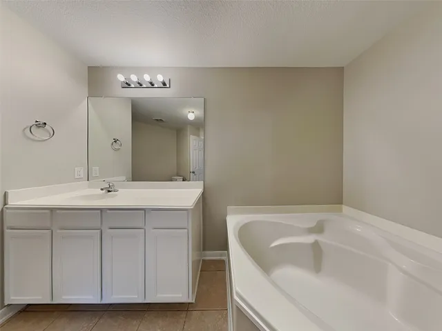 a view of a house with a yard and plants