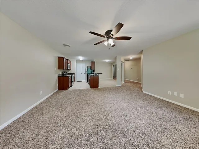 a kitchen with granite countertop a sink and a stove