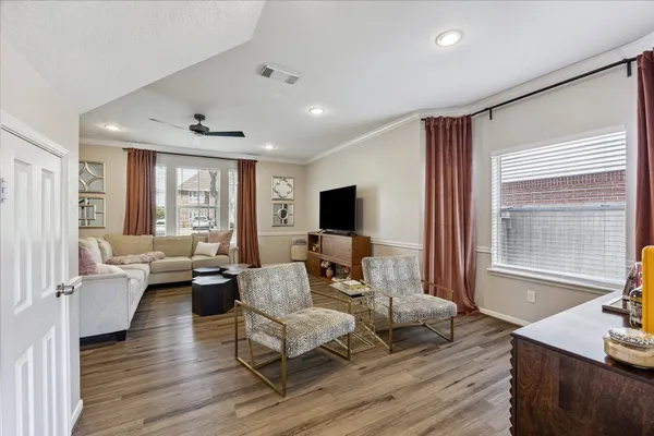 a kitchen with stainless steel appliances granite countertop a refrigerator sink and stove