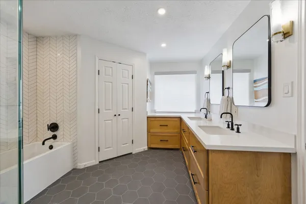 a view of walk in closet with clothes
