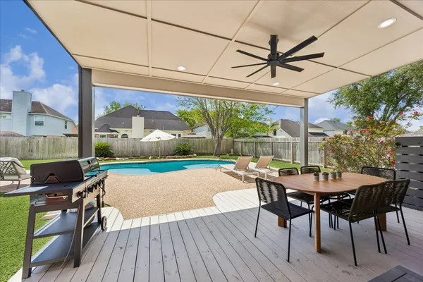 a view of a house with swimming pool and porch