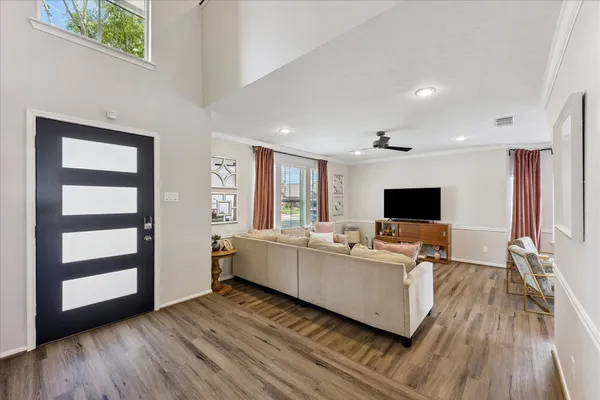a living room with furniture and a flat screen tv