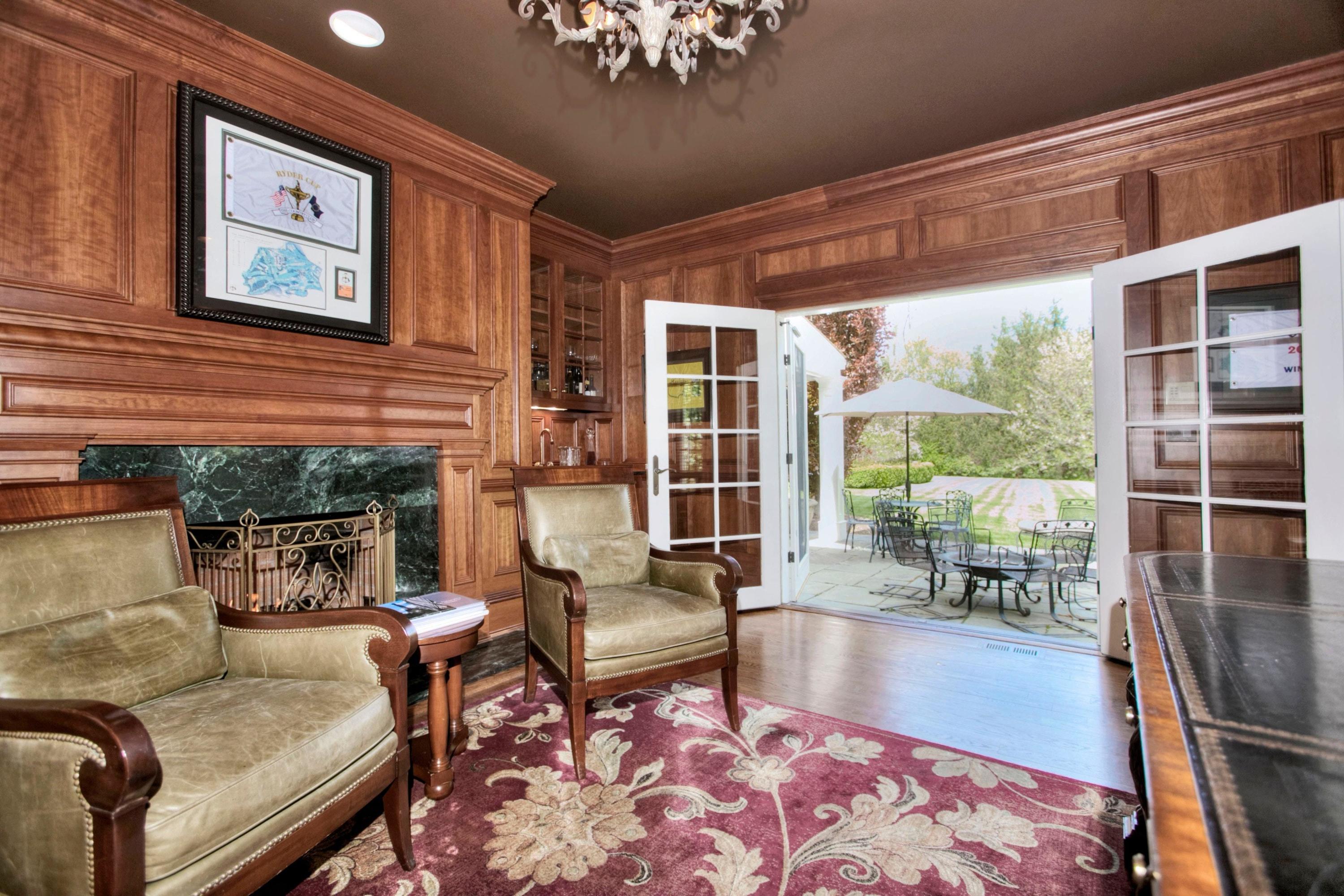 1325 Smith Ridge Road New Canaan, CT 06840 - Photo 13 of 28 a living room with furniture and a large window