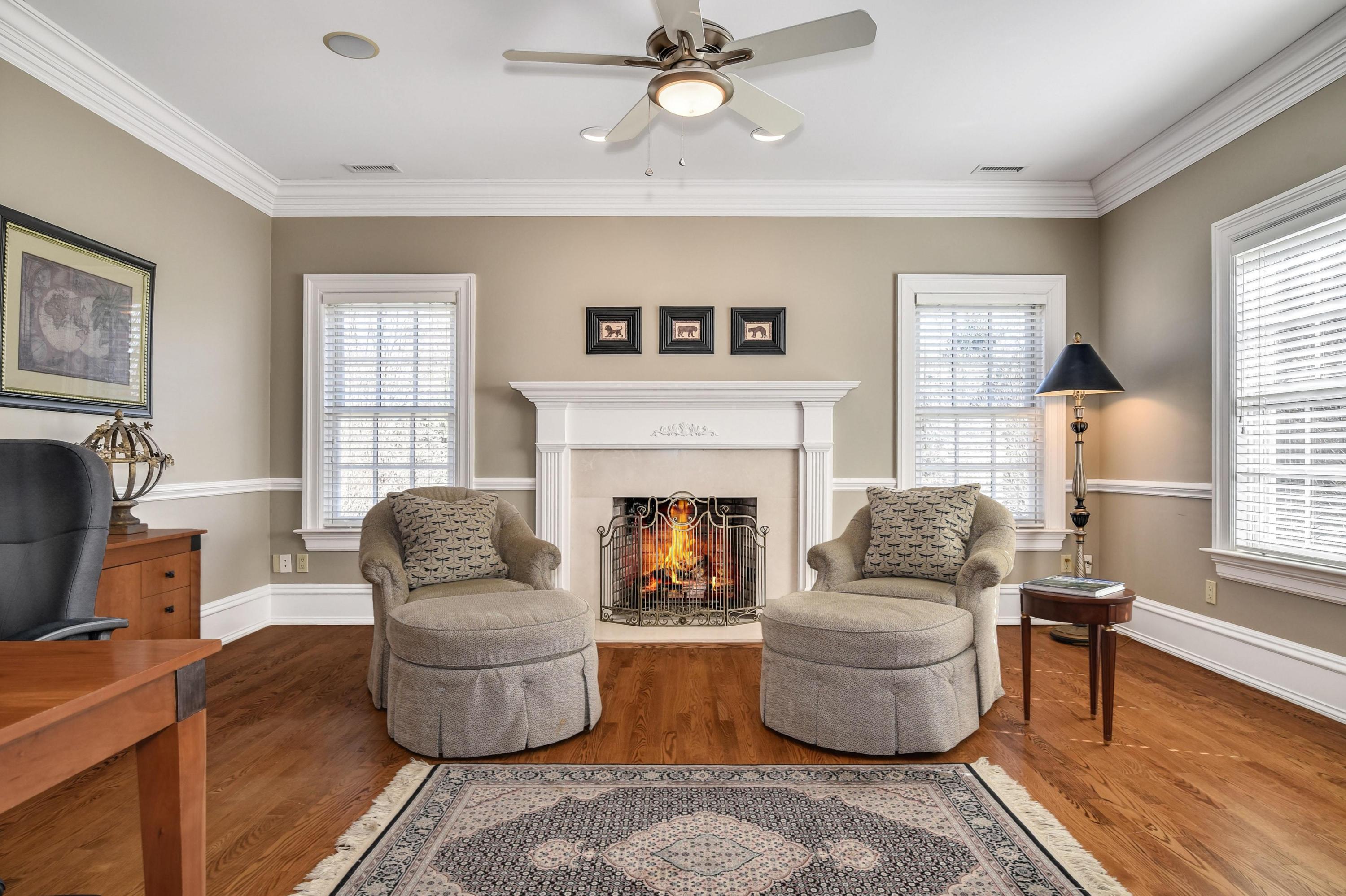 1325 Smith Ridge Road New Canaan, CT 06840 - Photo 16 of 28 a living room with furniture and a fireplace