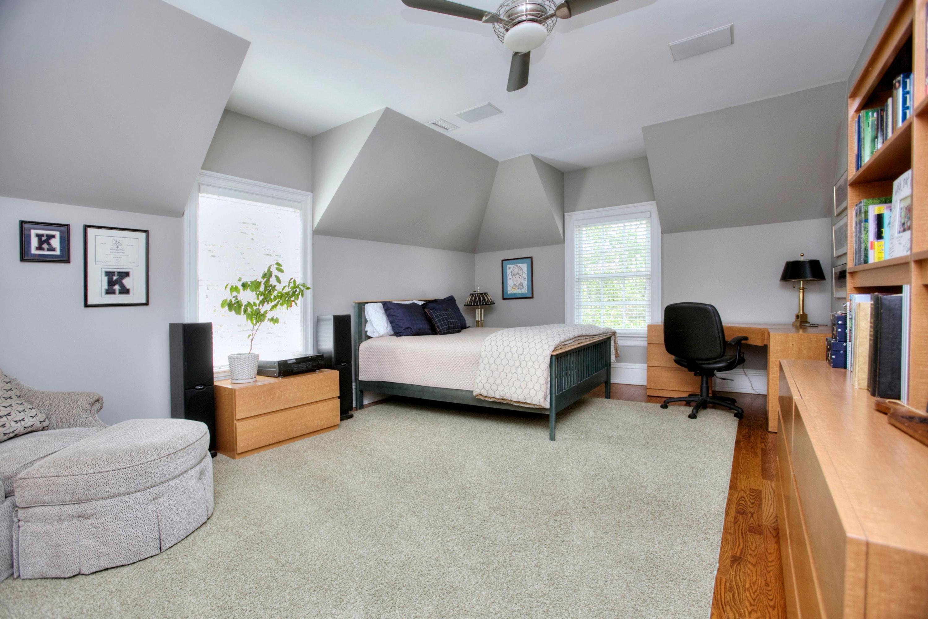 1325 Smith Ridge Road New Canaan, CT 06840 - Photo 17 of 28 a bedroom with a bed couches chair and a potted plant