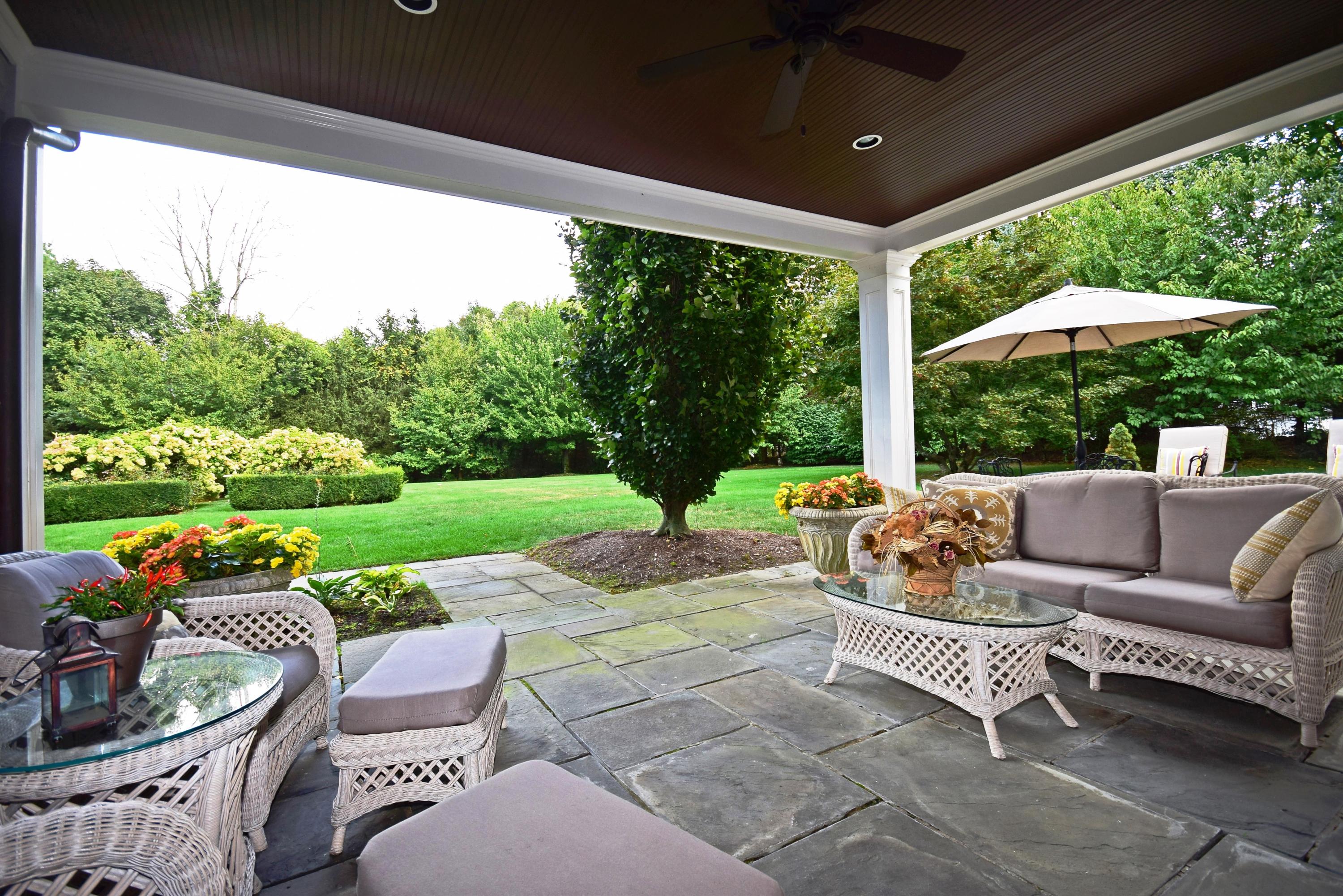 1325 Smith Ridge Road New Canaan, CT 06840 - Photo 22 of 28 a patio with yard table and chairs