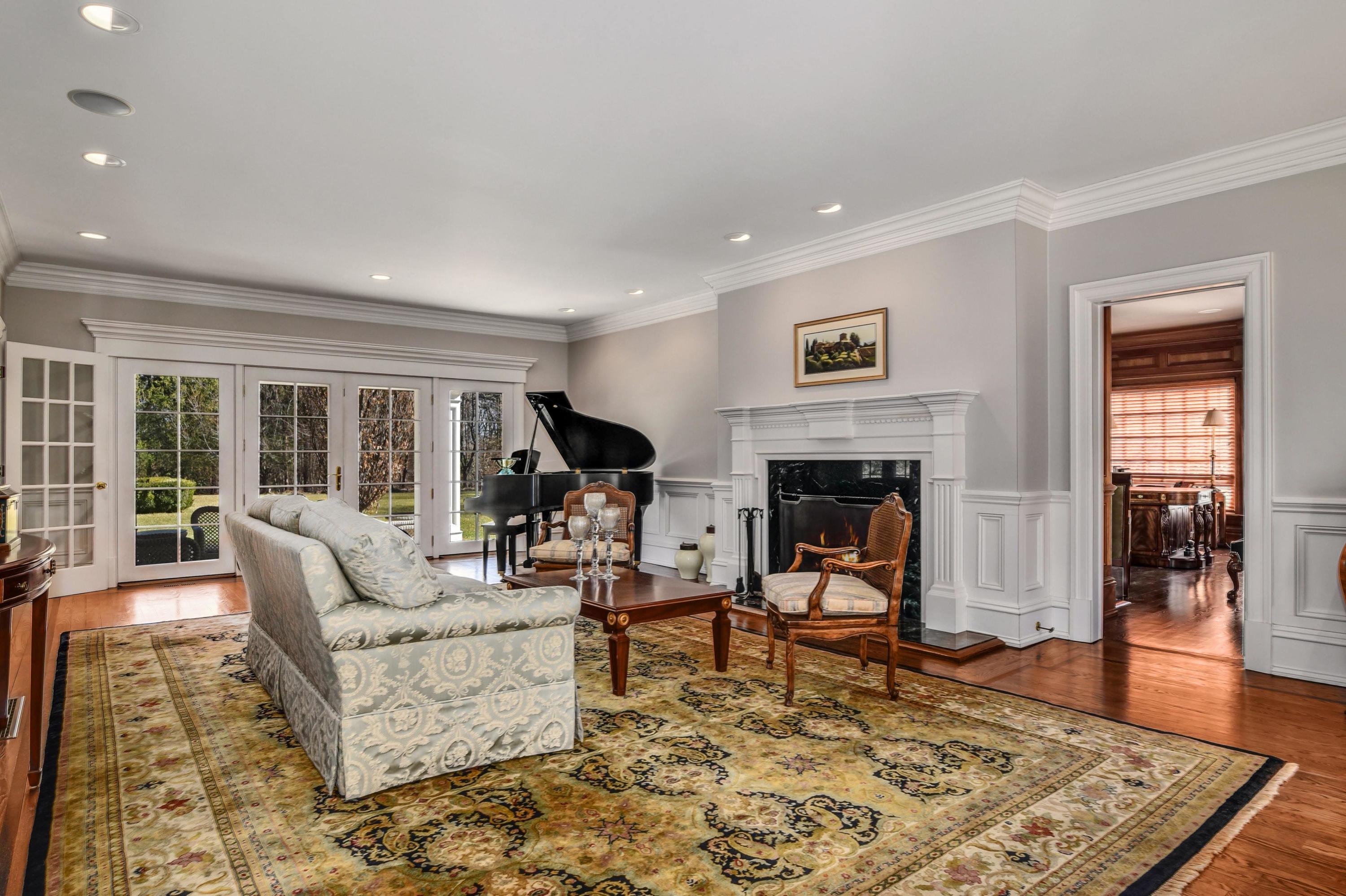 1325 Smith Ridge Road New Canaan, CT 06840 - Photo 4 of 28 a living room with furniture rug and window