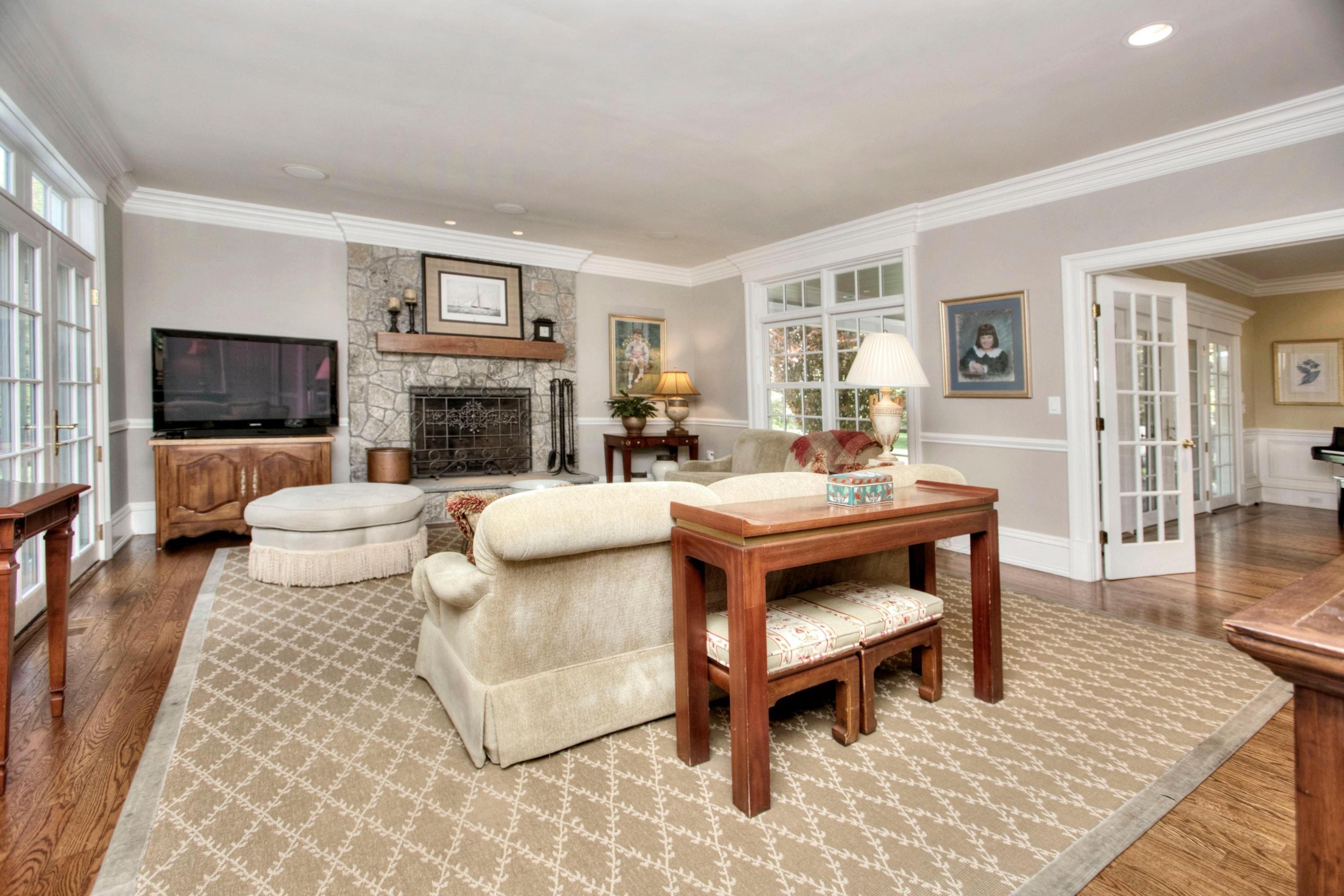 1325 Smith Ridge Road New Canaan, CT 06840 - Photo 10 of 28 a living room with fireplace furniture and a flat screen tv