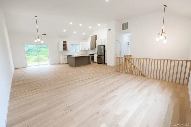 a view of kitchen with wooden floor