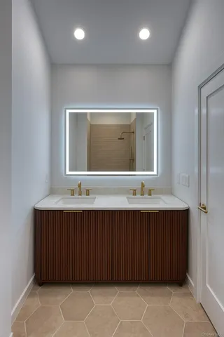 a bathroom with a sink and a mirror
