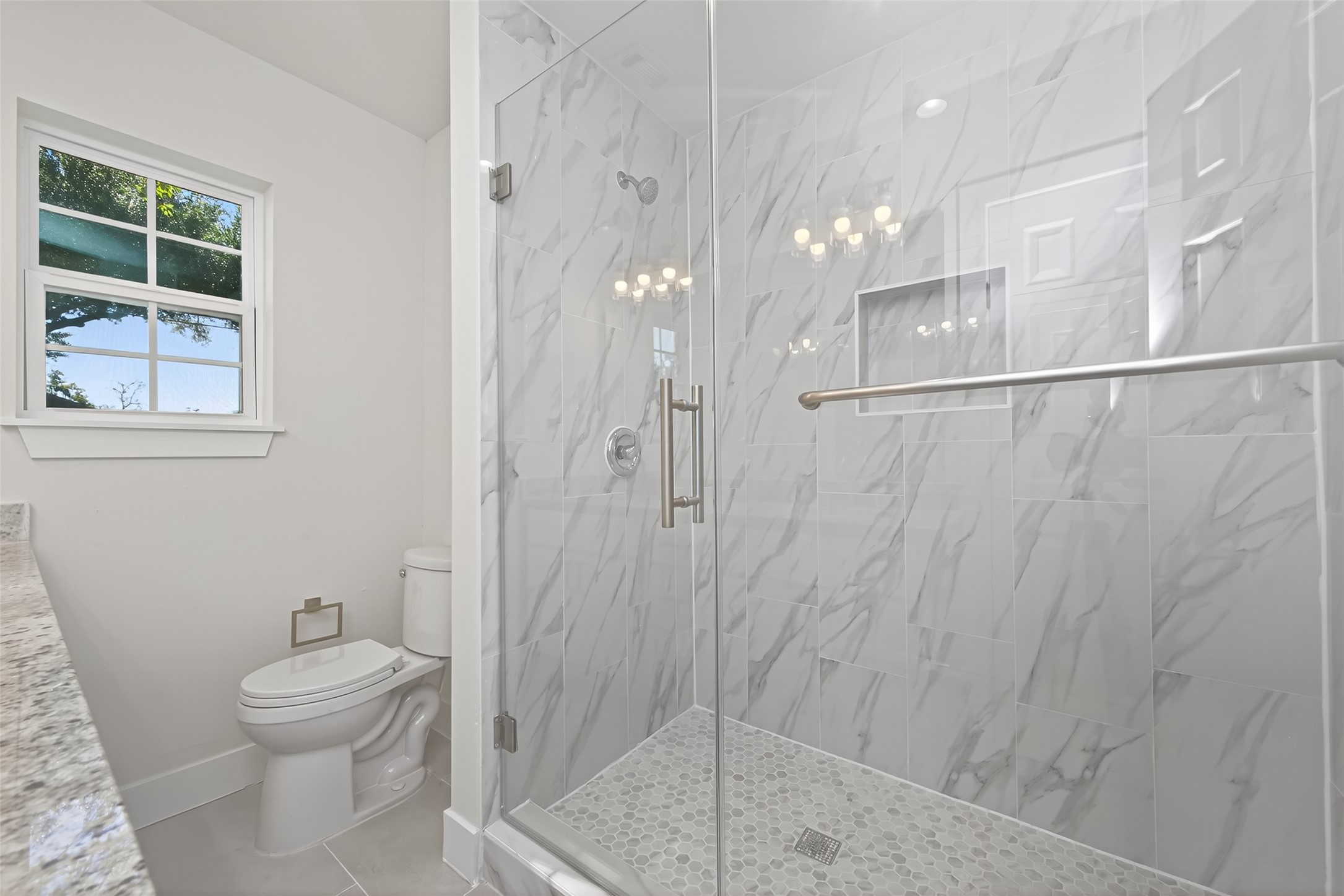 1418 Carlisle Street Rosenberg, TX 77471 - Photo 13 of 49 a bathroom with a shower a toilet and a sink