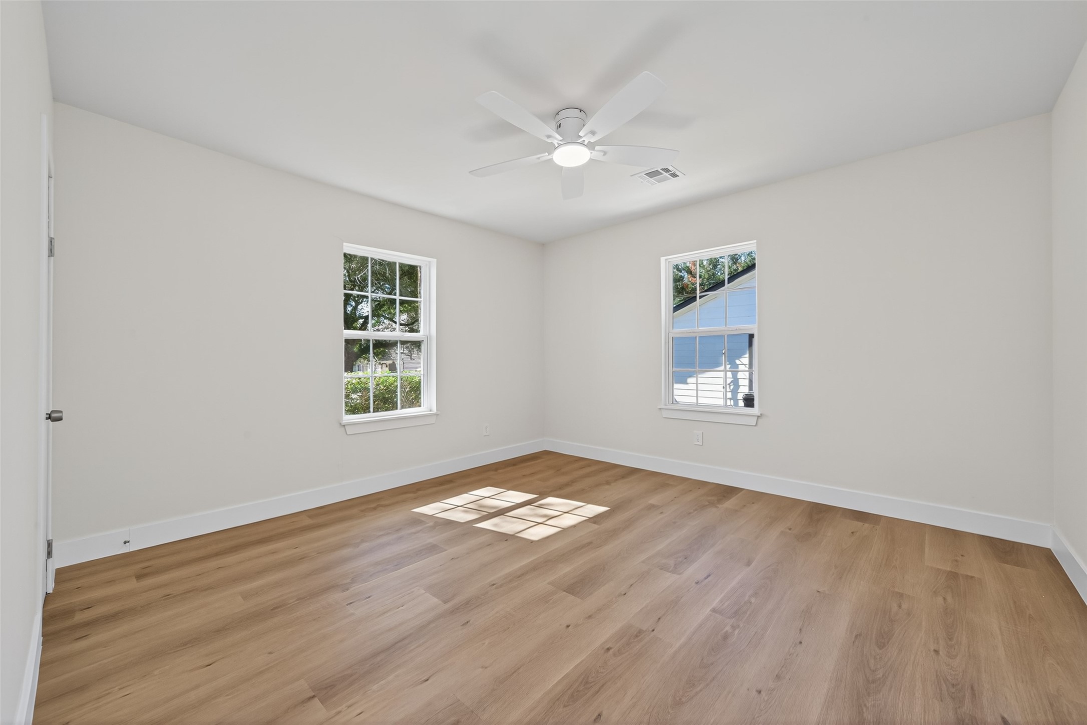 1418 Carlisle Street Rosenberg, TX 77471 - Photo 14 of 49 wooden floor in an empty room with a window