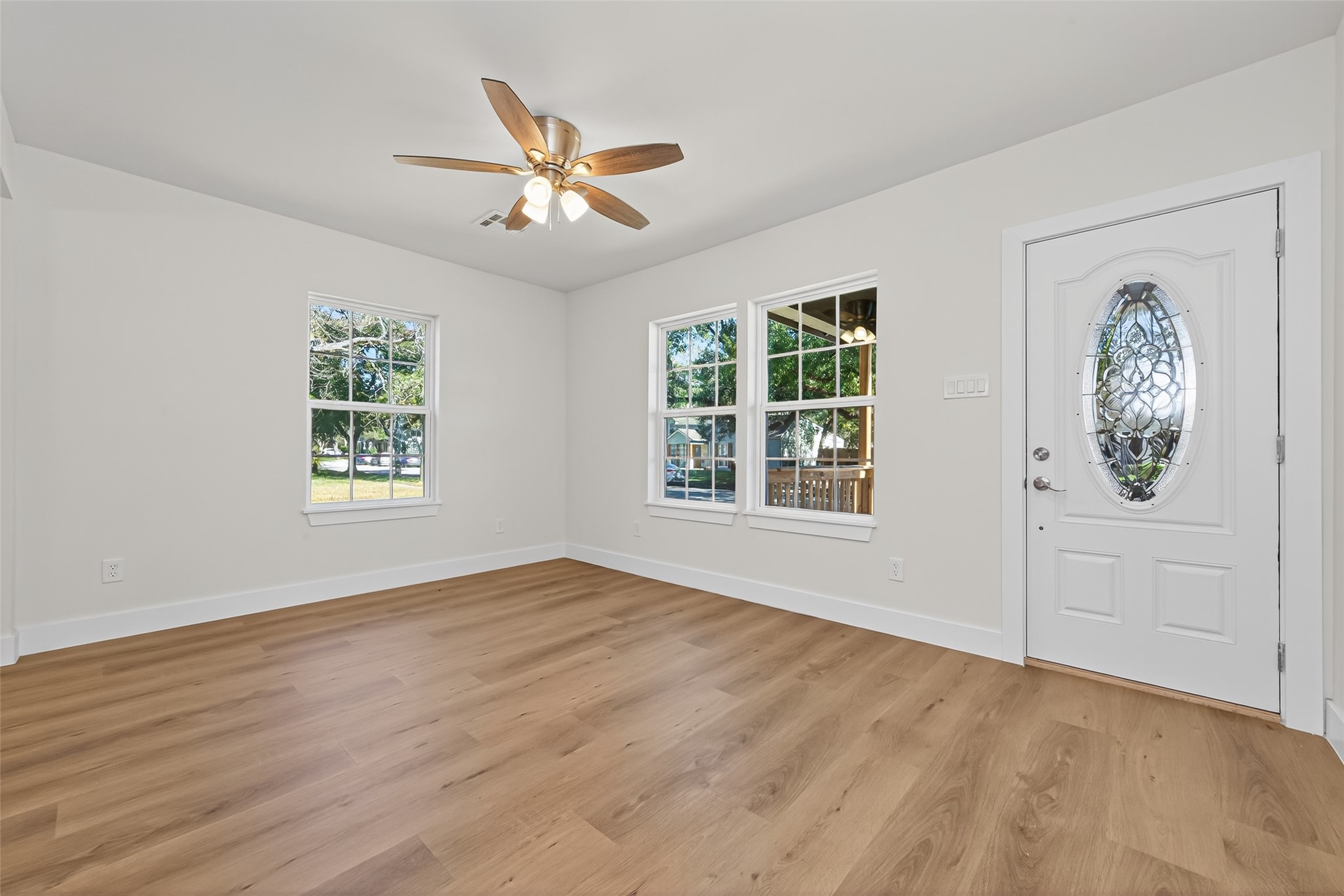 1418 Carlisle Street Rosenberg, TX 77471 - Photo 23 of 49 a view of an empty room with a window and wooden floor