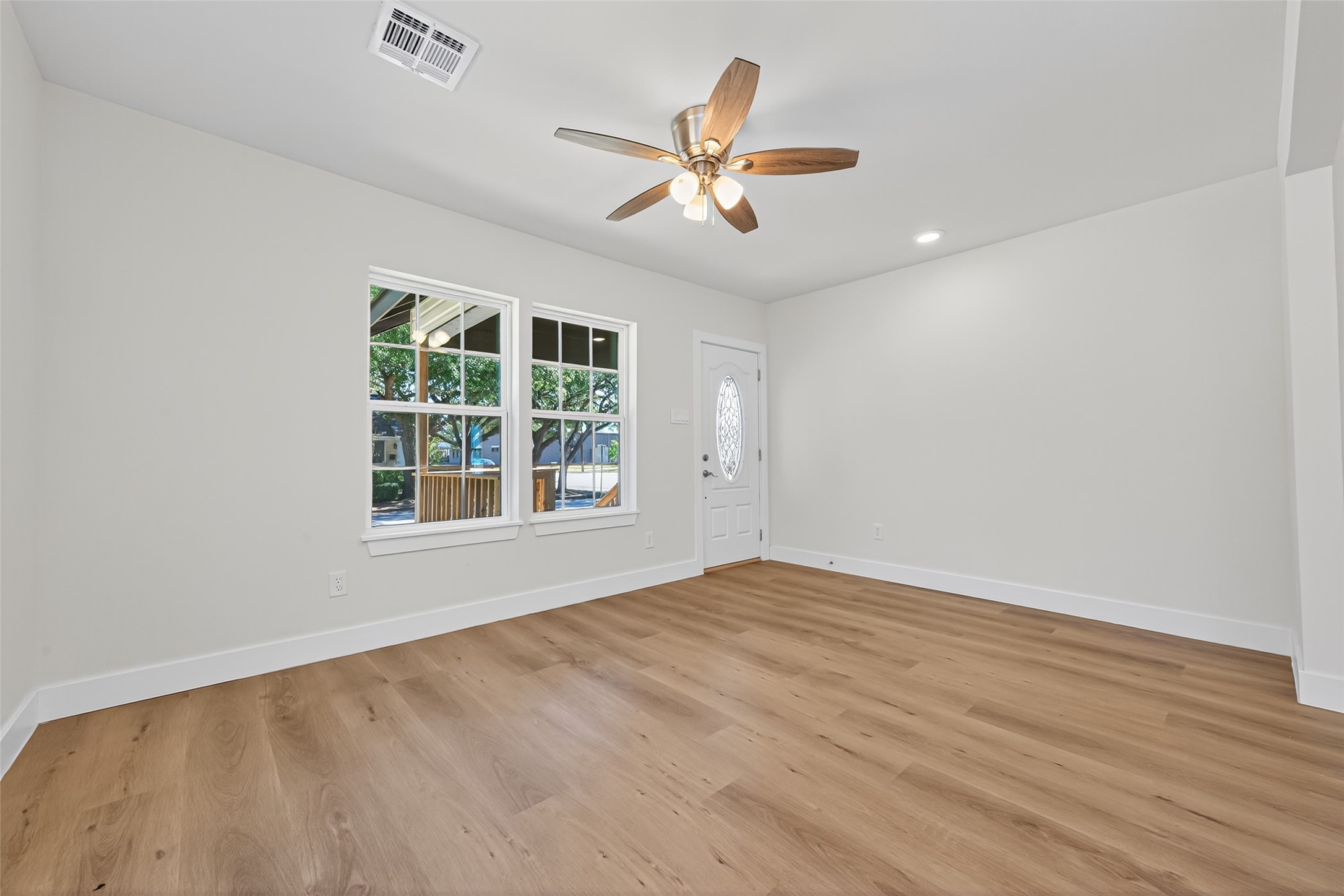 1418 Carlisle Street Rosenberg, TX 77471 - Photo 27 of 49 wooden floor in an empty room with a window