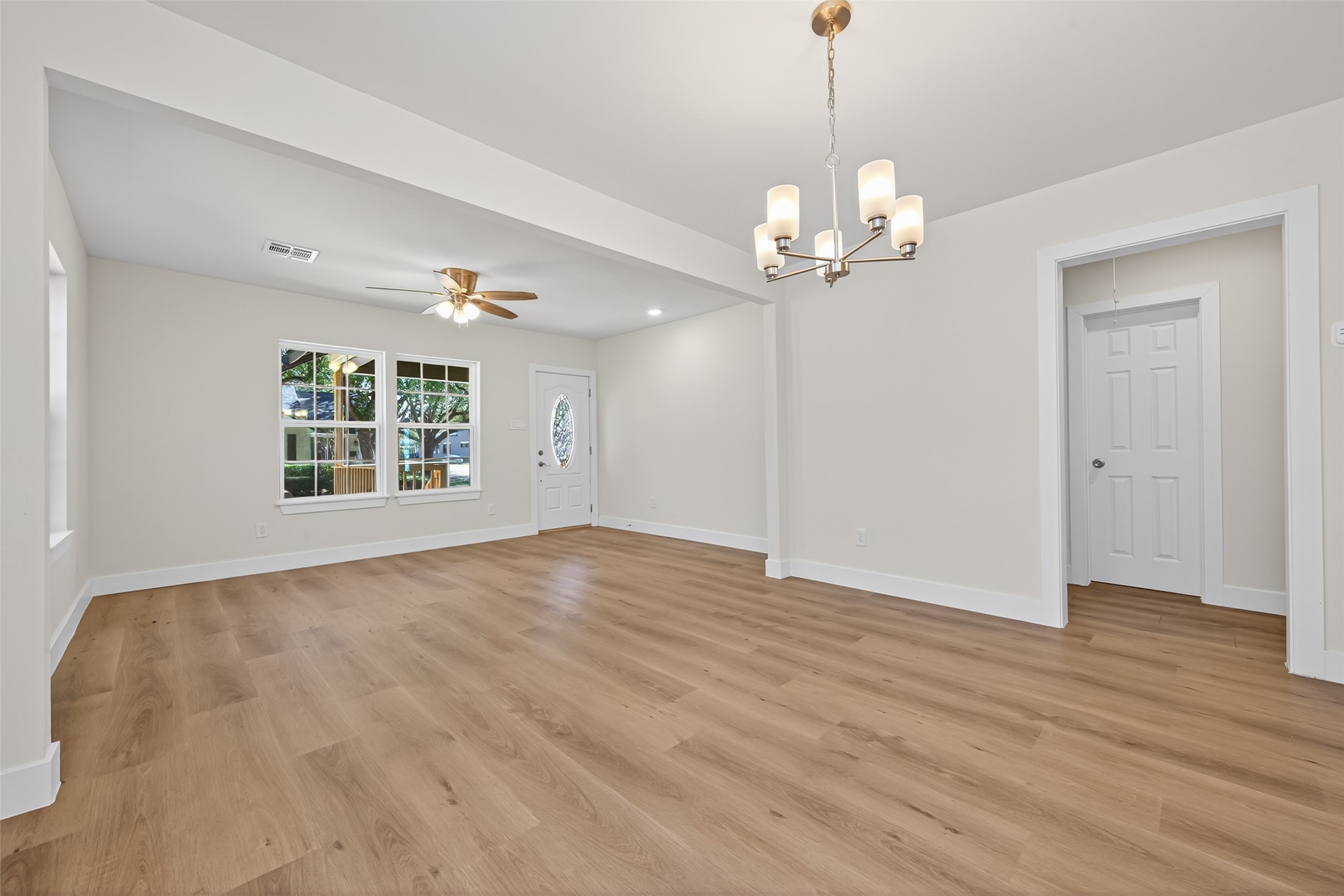 1418 Carlisle Street Rosenberg, TX 77471 - Photo 28 of 49 a view of an empty room with a window and wooden floor