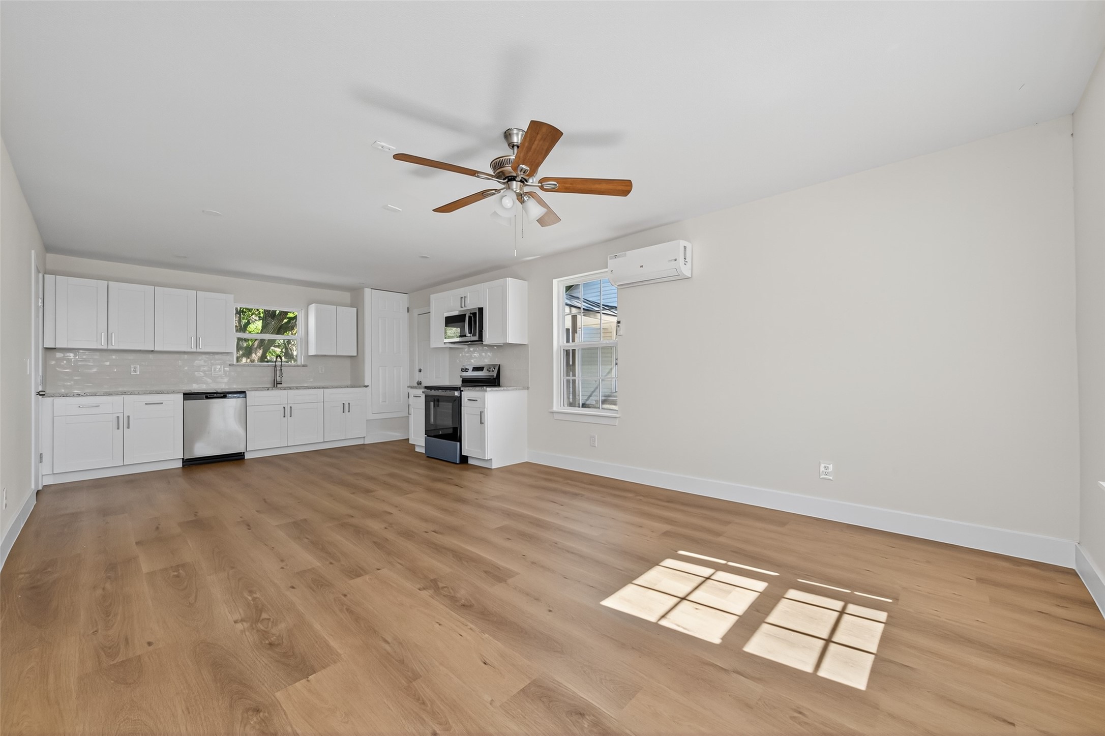 1418 Carlisle Street Rosenberg, TX 77471 - Photo 33 of 49 a view of empty room with wooden floor and ceiling fan
